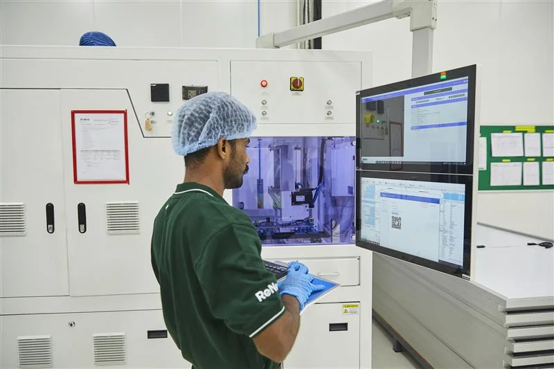 A technician monitoring automated equipment at ReNew’s Jaipur plant